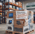 Pallet of insured high-value electronics in a warehouse featuring a clear commercial cargo insurance label.