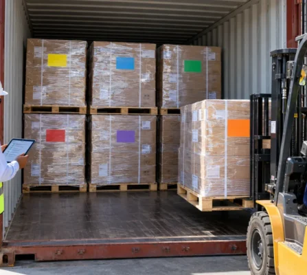 freight-consolidator-shared-lcl-container Forklift loading palletised cargo from different shippers into one shared LCL container