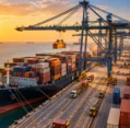 Container port with cargo vessel and cranes, part of international sea & air shipping from the UAE